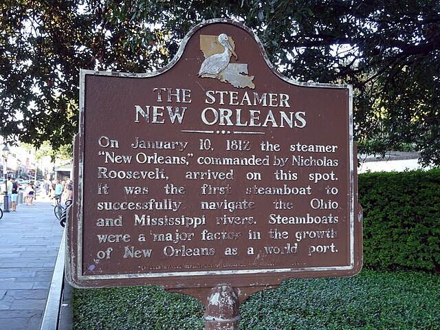 The Steamer historical marker on Decatur Street indicates that steamboats, such as the ship Madame Josephine Decuir boarded, traveled along the Mississippi River, establishing New Orleans as a port city for the transportation of cargo and passengers.