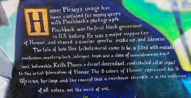 Artist Ian Wilkinson makes the distinction between Homer Plessy and P.B.S. Pinchback, and provides background on the creation of the mural.