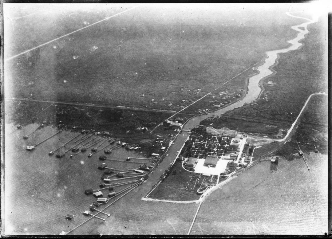Black and white photograph taken from above showing Lake Pontchartrain, its intersection with Bayou St. John and the area occupied by Spanish Fort Amusement Park.