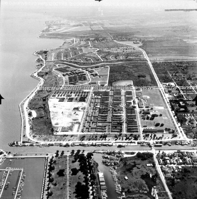 Black and white photo of lakefront from above.